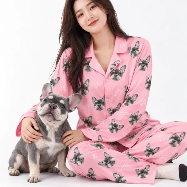 Woman in French bulldog pajamas cuddling her French bulldog — MyDogPics