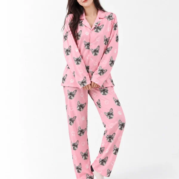 Woman wearing French bulldog pajamas covered in grey French bulldog faces on pink with white hearts and paws — MyDogPics