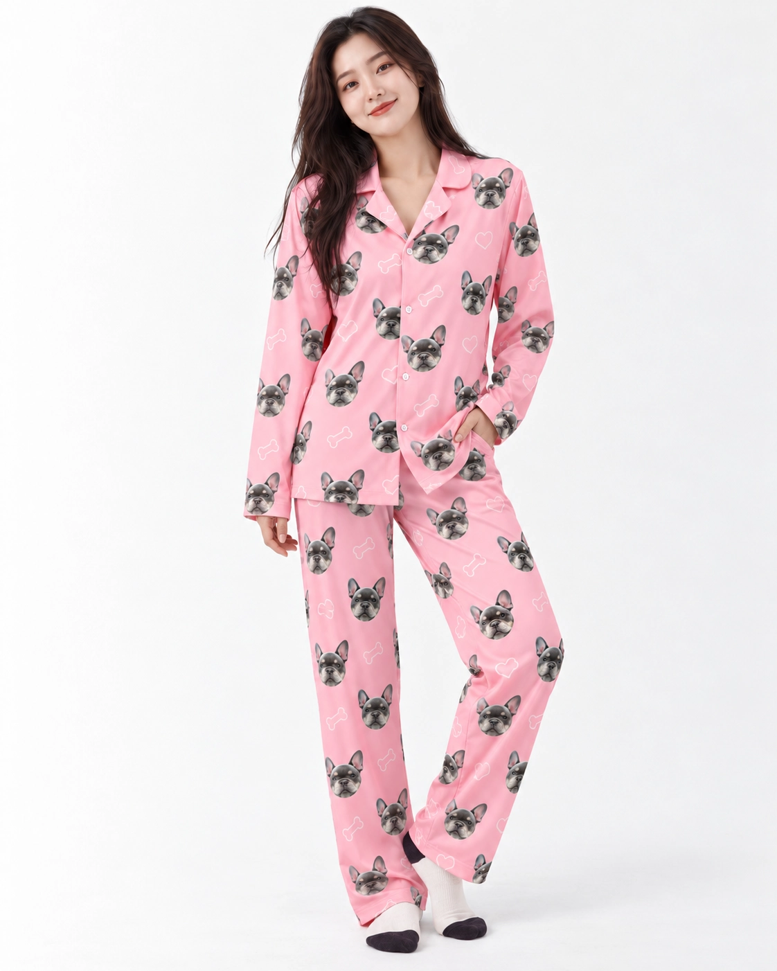 French Bulldog Pajamas – Pose | MyDogPics Woman posing in French bulldog pajamas, grey French bulldog faces on pink with white hearts and paws — MyDogPics