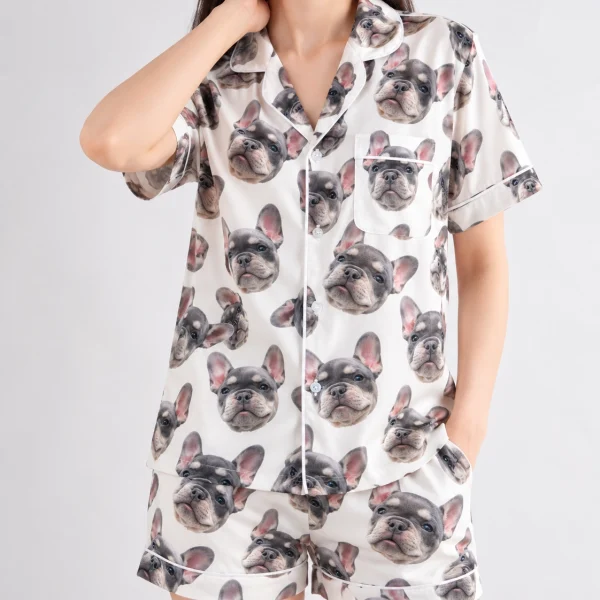 Close-up of the frenchie pajamas print: grey French bulldog faces on ivory satin with black paw prints — MyDogPics