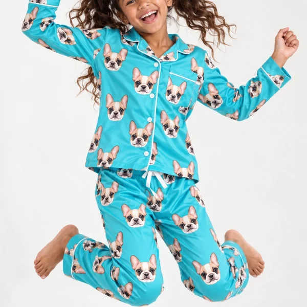 Girl posing in girls Christmas pajamas, cream French bulldog faces on teal satin — MyDogPics