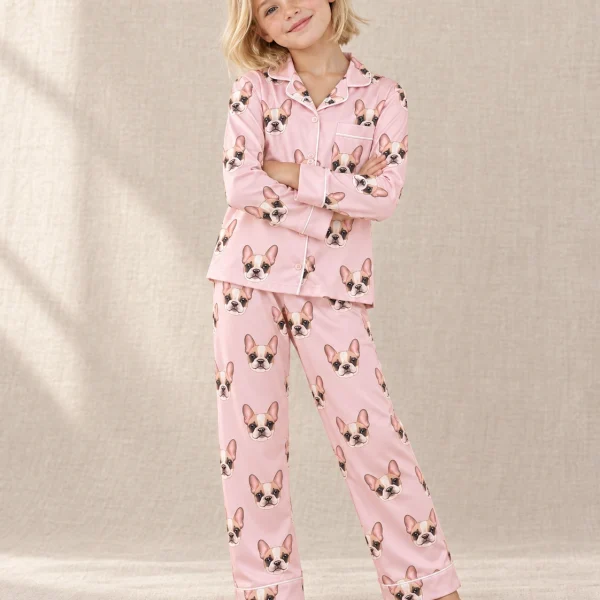 Girl wearing girls pajamas covered in cream French bulldog faces on blush pink satin — MyDogPics