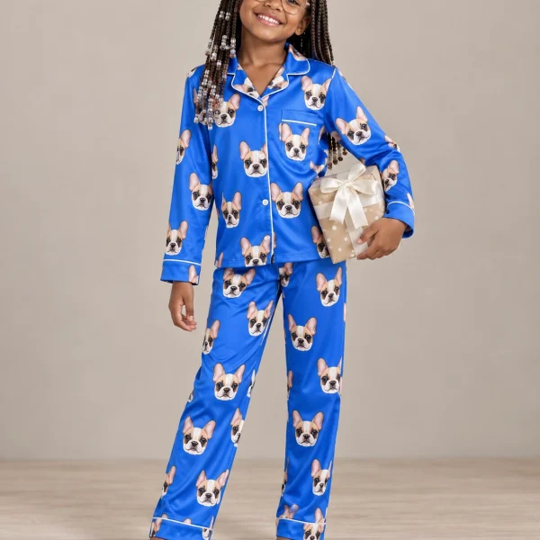 Girl wearing girls pajamas covered in cream French bulldog faces on royal blue satin — MyDogPics