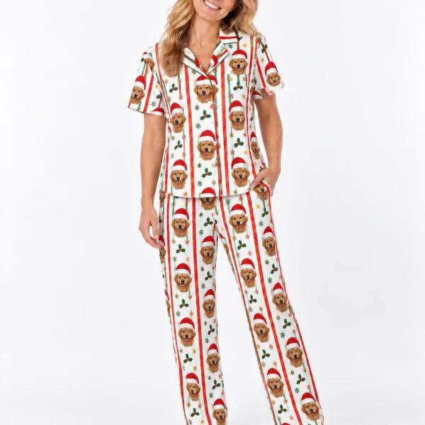 Woman wearing golden retriever Christmas pajamas covered in golden retriever faces in Santa hats — MyDogPics