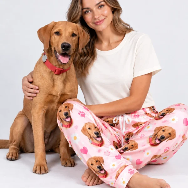 Woman in golden retriever pajama pants cuddling her golden retriever — MyDogPics