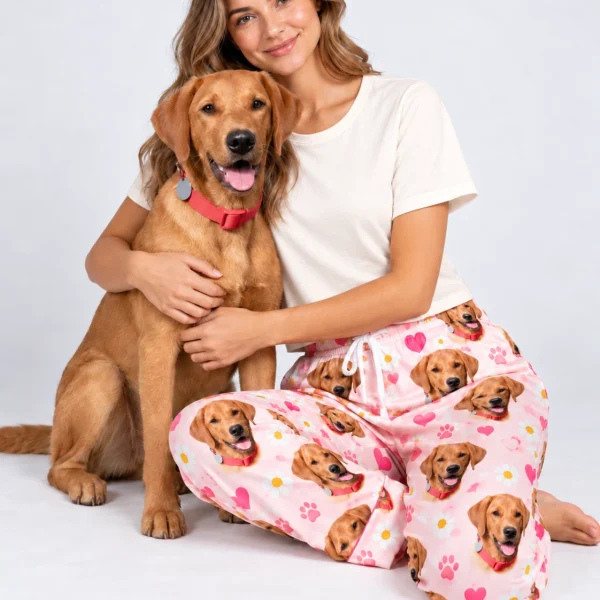 Woman in golden retriever pajama pants cuddling her golden retriever — MyDogPics