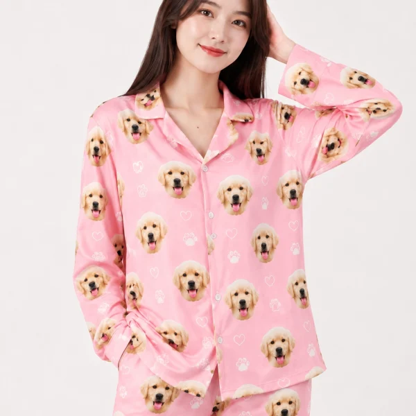 Close-up of the golden retriever pajamas print: golden retriever puppy faces on pink with white paw prints — MyDogPics