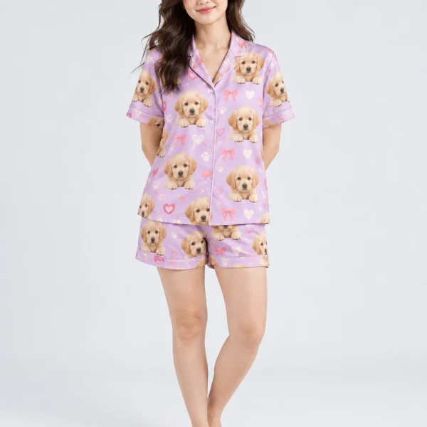 Woman wearing a golden retriever pajamas for women covered in golden retriever puppy faces — MyDogPics