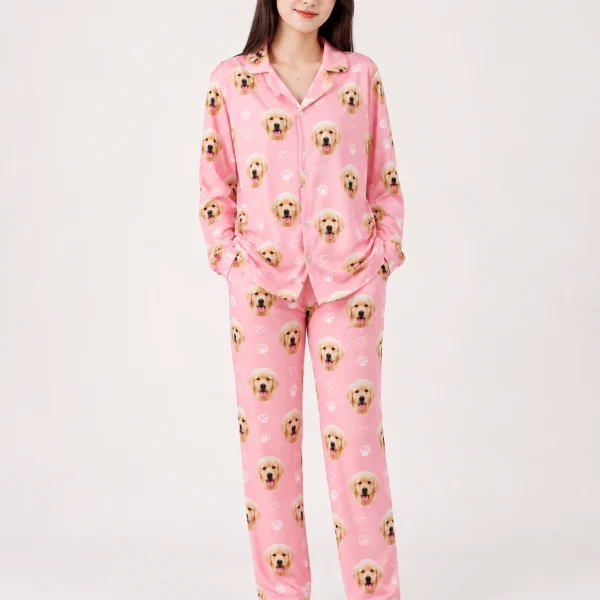 Woman wearing golden retriever pajamas covered in golden retriever puppy faces on pink with white paw prints — MyDogPics