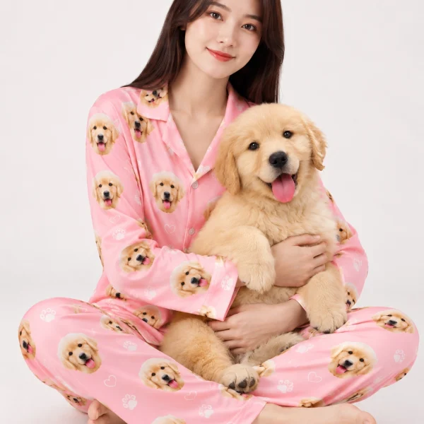Woman in golden retriever pajamas holding her golden retriever puppy — MyDogPics