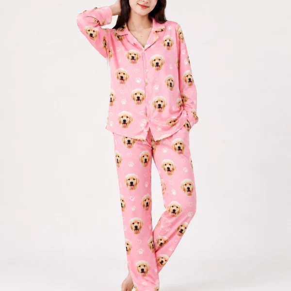 Woman posing in golden retriever pajamas, golden retriever puppy faces on pink with white paw prints — MyDogPics