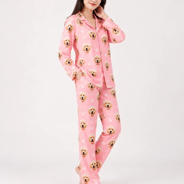 Woman posing in golden retriever pajamas, golden retriever puppy faces on pink with white paw prints — MyDogPics