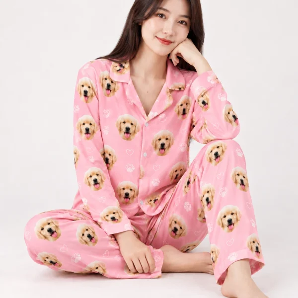 Woman sitting in golden retriever pajamas covered in golden retriever puppy faces — MyDogPics