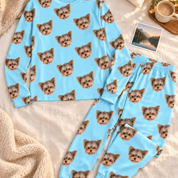 Flat lay of holiday pajamas: top and pants covered in Yorkshire terrier faces — MyDogPics