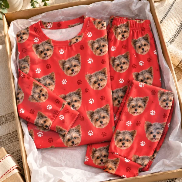 Flat lay of holiday pajamas: top and pants covered in Yorkshire terrier faces — MyDogPics
