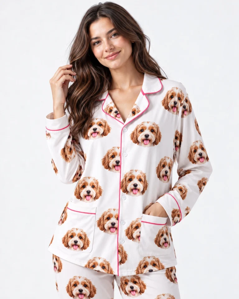 Close-up of the long sleeve pajamas print: doodle puppy faces on white fabric with contrast piping — MyDogPics