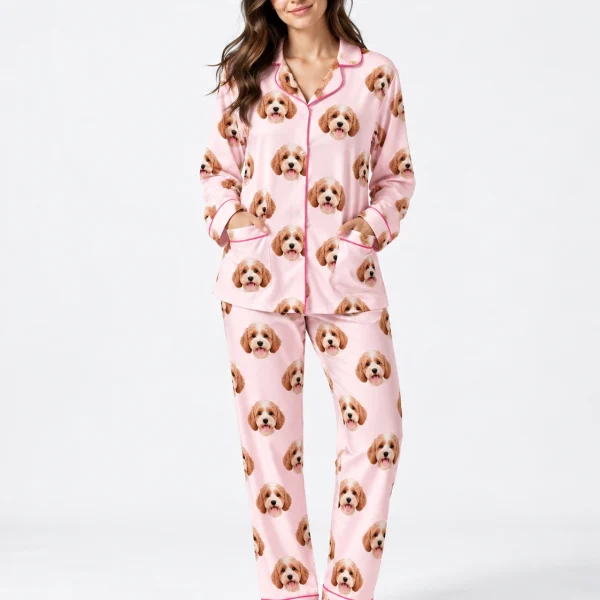 Woman wearing long sleeve pajamas covered in doodle puppy faces on light pink fabric with contrast piping — MyDogPics