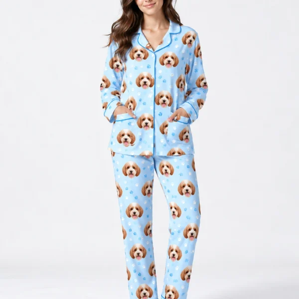 Woman posing in long sleeve pajamas, doodle puppy faces on light blue fabric with contrast piping — MyDogPics