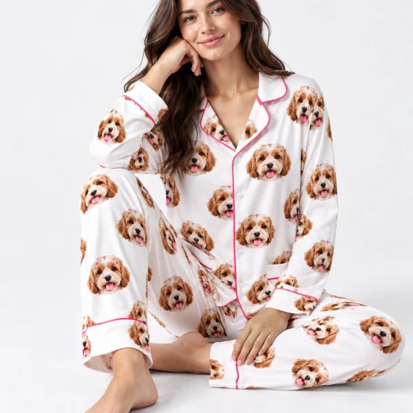Woman sitting in long sleeve pajamas covered in doodle puppy faces — MyDogPics