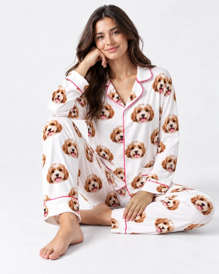 Woman sitting in long sleeve pajamas covered in doodle puppy faces — MyDogPics