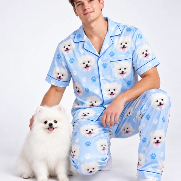 Man in matching couple pajamas cuddling his Pomeranian — MyDogPics