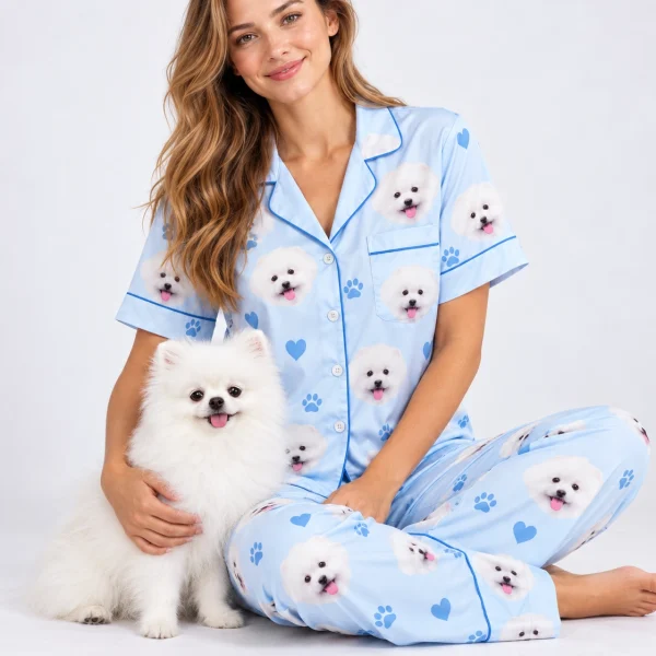 Woman in matching couple pajamas cuddling her Pomeranian — MyDogPics