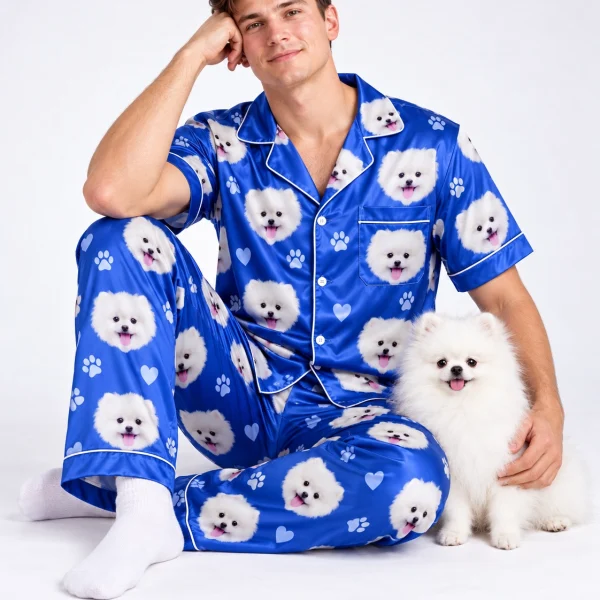 Man in matching couple pajamas cuddling his Pomeranian — MyDogPics