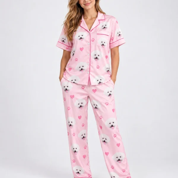 Woman wearing matching couple pajamas covered in white Pomeranian faces — MyDogPics