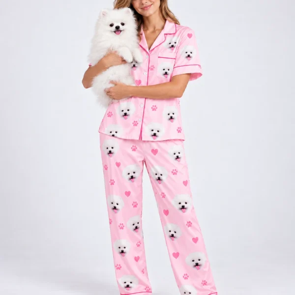 Woman in matching couple pajamas holding her Pomeranian — MyDogPics