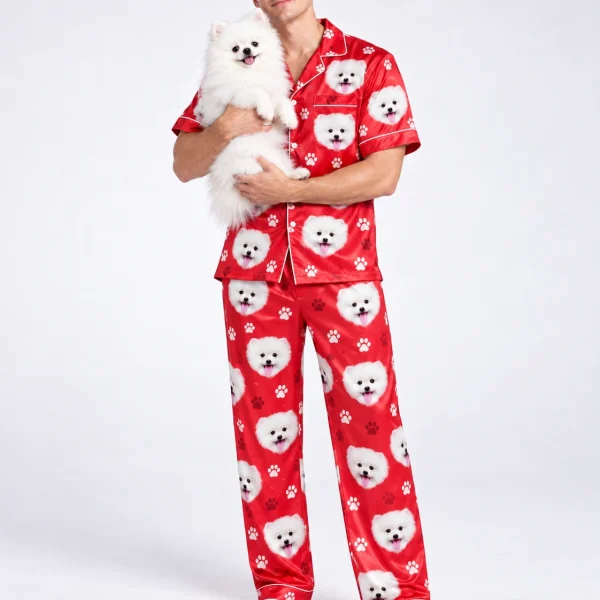 Man in matching couple pajamas holding his Pomeranian — MyDogPics