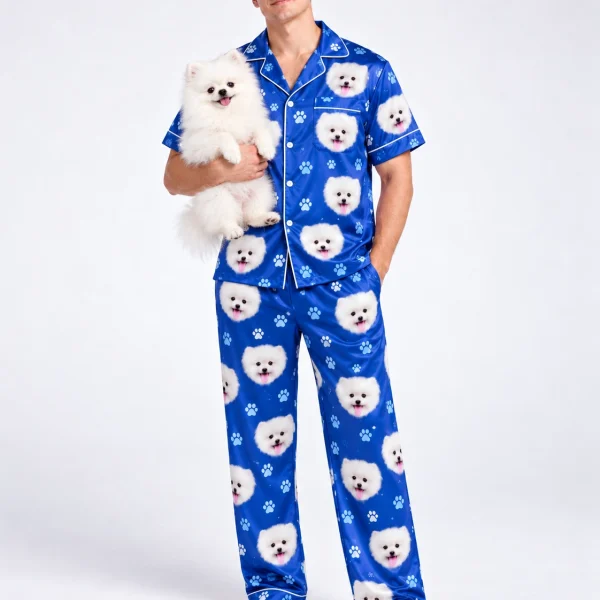 Man in matching couple pajamas holding his Pomeranian — MyDogPics