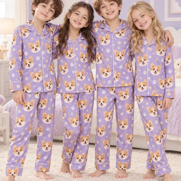 Kids wearing matching kids pajamas with corgi faces on lavender satin with paw prints — MyDogPics