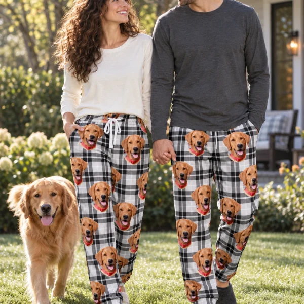 Woman and her partner in matching matching pajama pants with golden retriever faces on white plaid fabric — MyDogPics