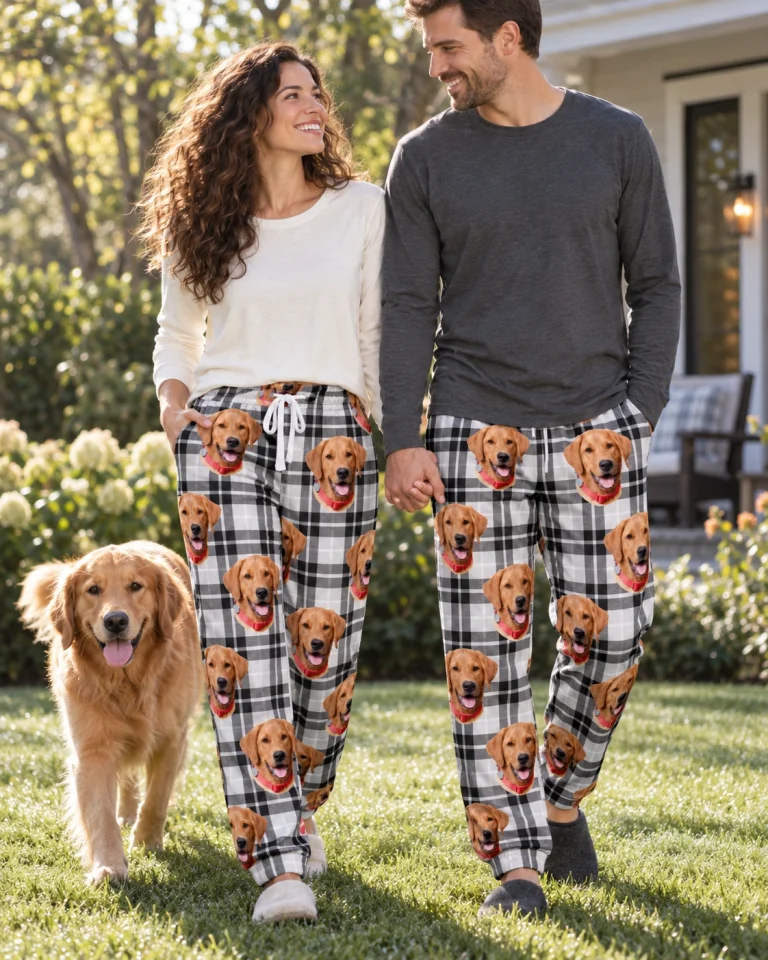 Woman and her partner in matching matching pajama pants with golden retriever faces on white plaid fabric — MyDogPics