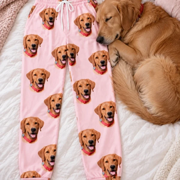 Flat lay of matching pajama pants: pants covered in golden retriever faces — MyDogPics