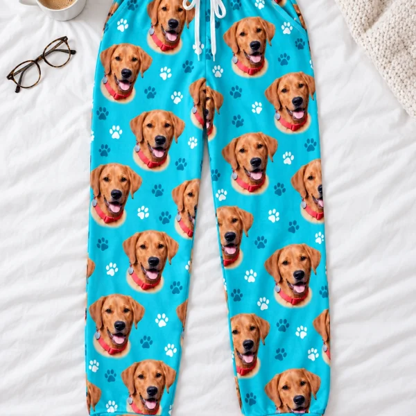 Flat lay of matching pajama pants: pants covered in golden retriever faces — MyDogPics