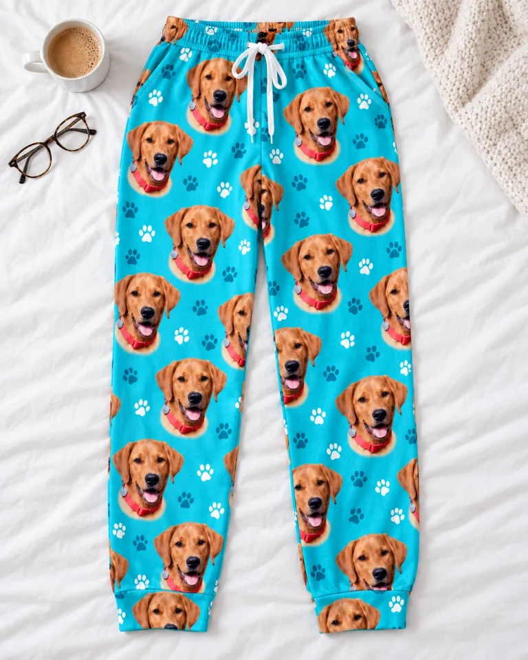 Flat lay of matching pajama pants: pants covered in golden retriever faces — MyDogPics