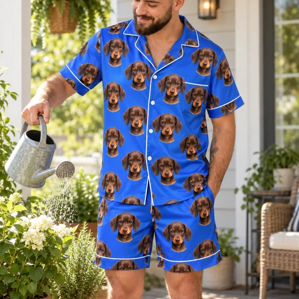 Man posing in men PJs, brown dachshund puppy faces on royal blue satin — MyDogPics