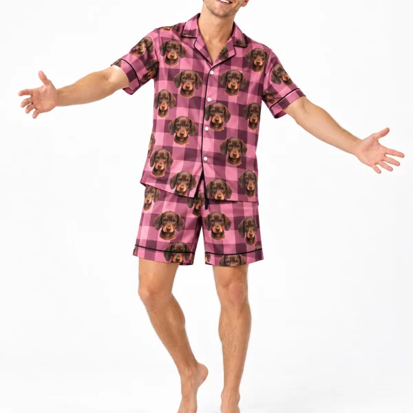 Man wearing mens festive pajamas covered in brown dachshund puppy faces on pink plaid satin — MyDogPics