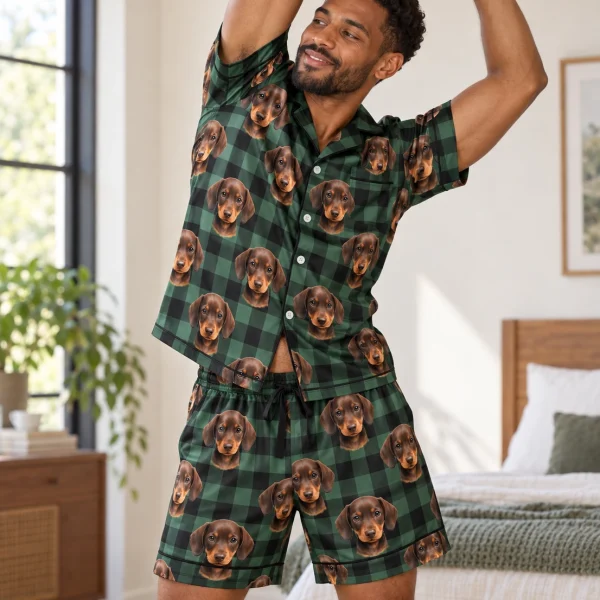 Man posing in mens festive pajamas, brown dachshund puppy faces on green plaid satin — MyDogPics