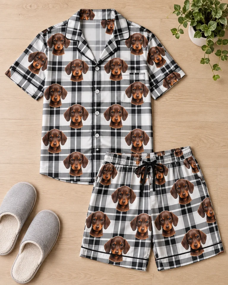 Flat lay of a mens pajama set: shirt and shorts covered in brown dachshund puppy faces — MyDogPics