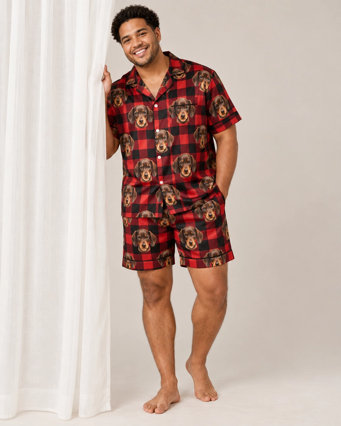 Men’s Pajama Set – Front View, Red Plaid | MyDogPics Man wearing a mens pajama set covered in brown dachshund puppy faces on red plaid satin — MyDogPics