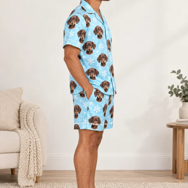 Side view of a mens pajama set with brown dachshund puppy faces on light blue snowflake satin — MyDogPics