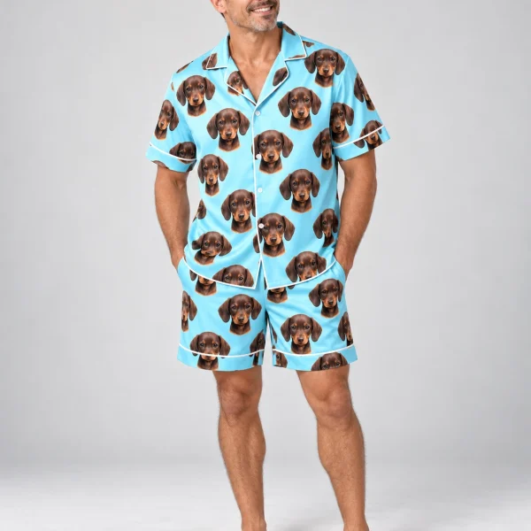 Man wearing mens pajama shorts covered in brown dachshund puppy faces on light blue satin — MyDogPics