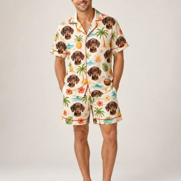 Man wearing a mens pajama shorts set covered in dachshund faces on a cream tropical print — MyDogPics
