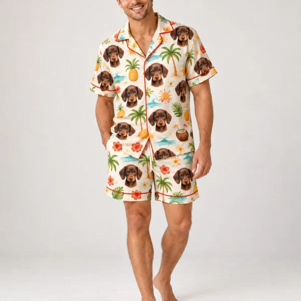 Man posing in a mens pajama shorts set, dachshund faces on a cream tropical print — MyDogPics