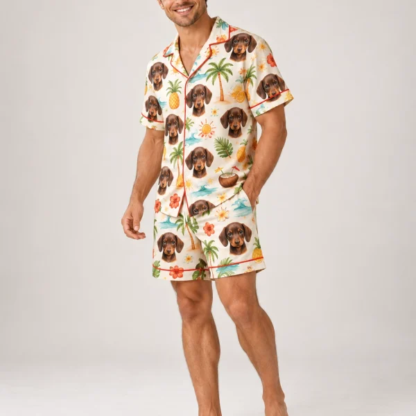 Man posing in a mens pajama shorts set, dachshund faces on a cream tropical print — MyDogPics
