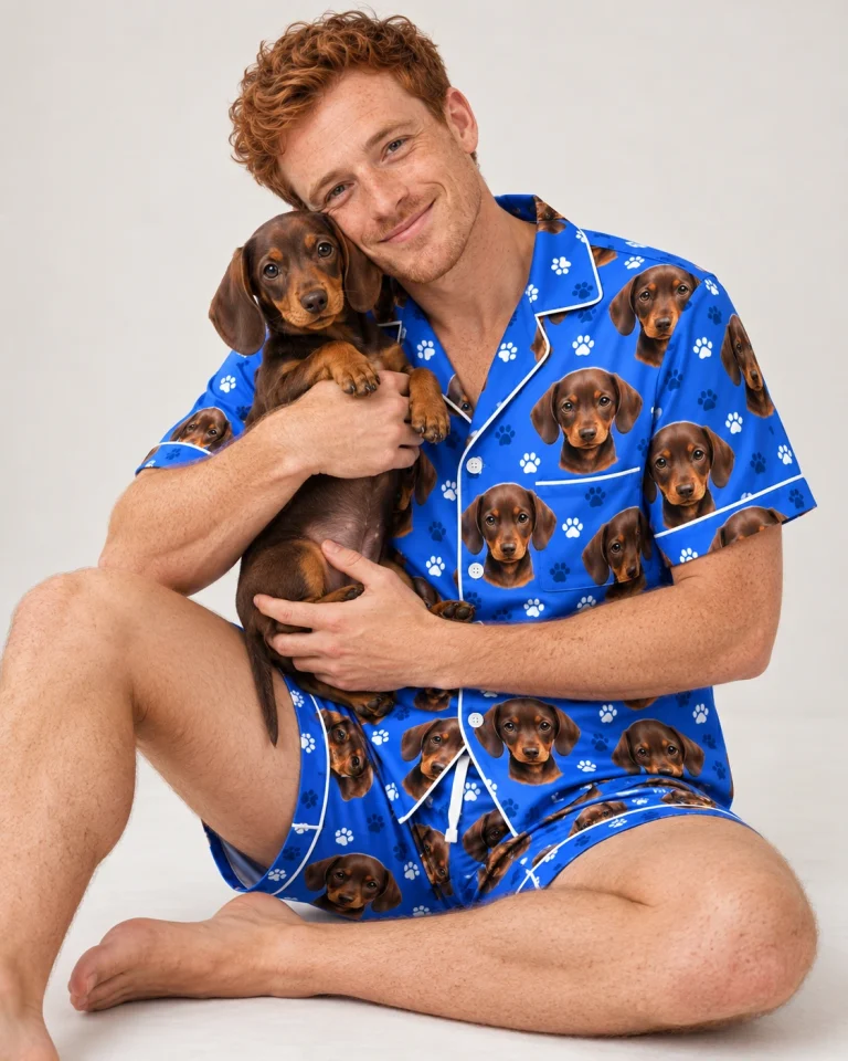 Man in mens pajamas cuddling his dachshund — MyDogPics
