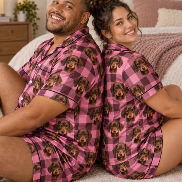 Man and his partner in matching mens pajamas with brown dachshund puppy faces on pink plaid satin — MyDogPics