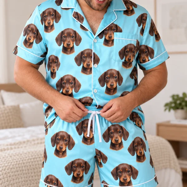 Man wearing mens pajamas covered in brown dachshund puppy faces on light blue satin — MyDogPics